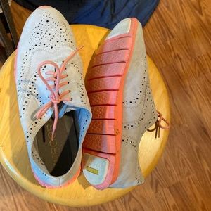 Beautiful Cole Haan flats worn once time.tangerine soles and laces. No damage.
